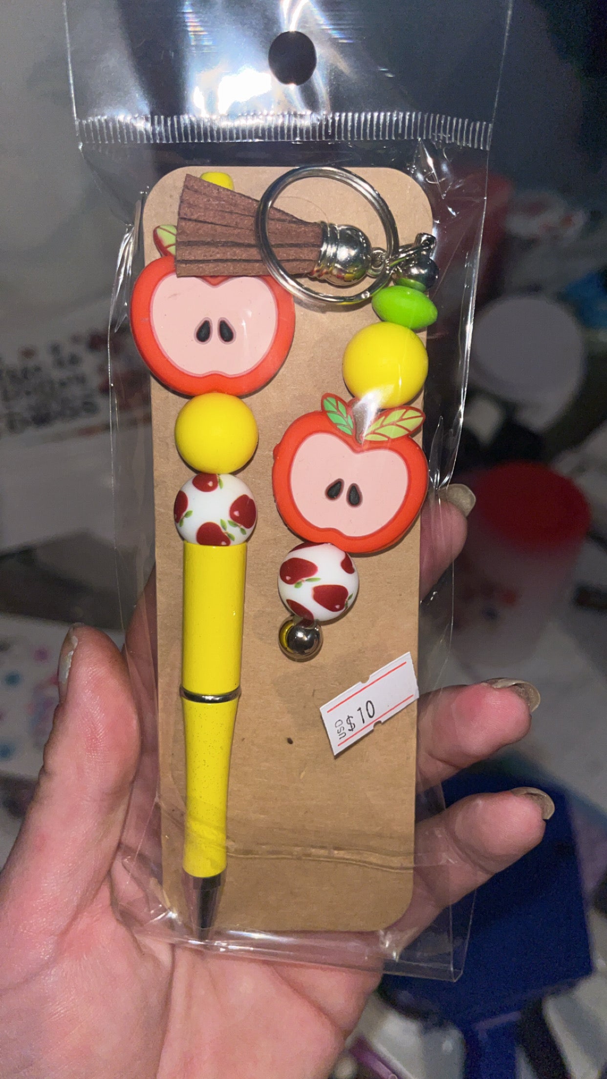Apple style keychain and pen bundle