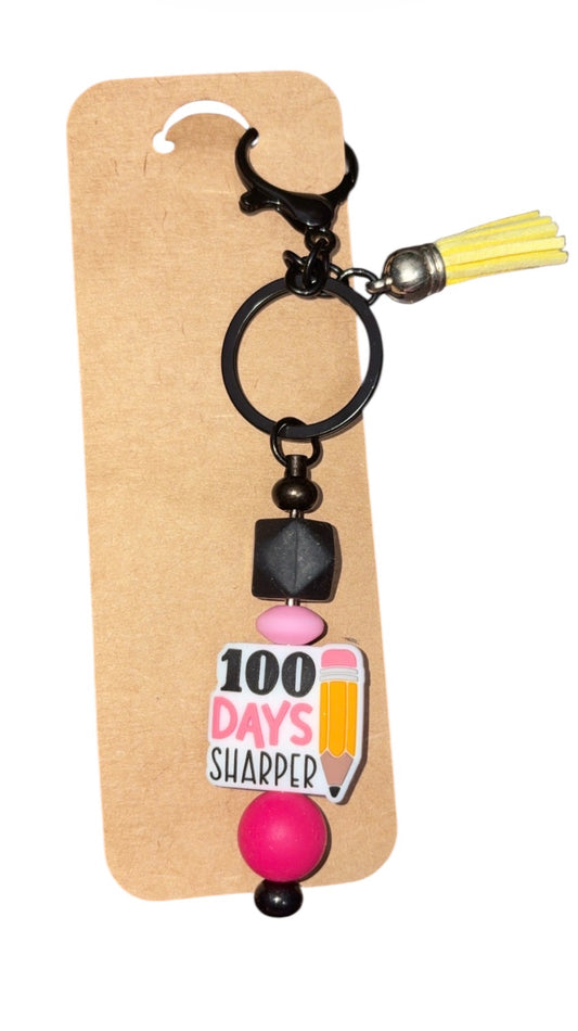 “100 days sharper “ keychain