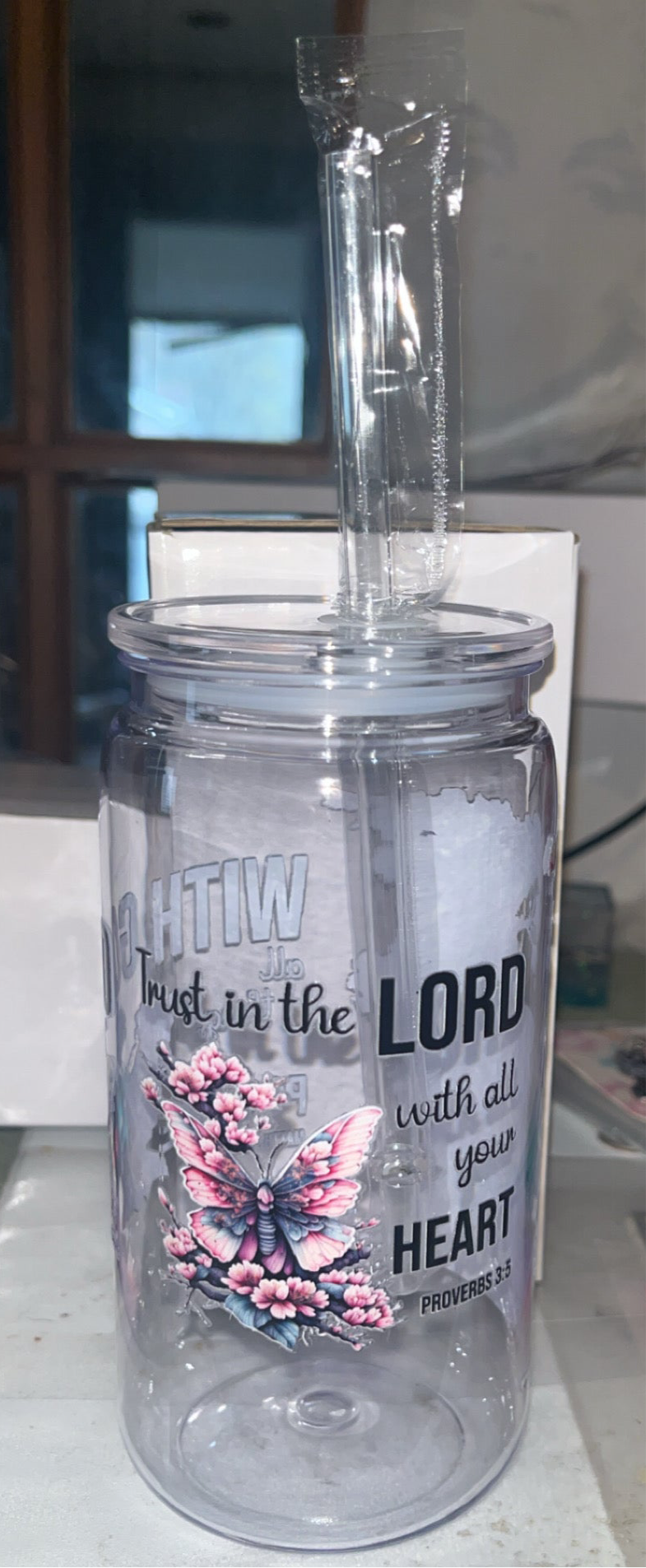 16oz plastic cup with jelly colored lid W/straw “ with God all things are possible”